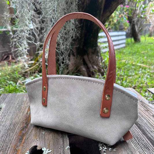 last state leather's suede mini handbag in slate with chestnut handles profile view